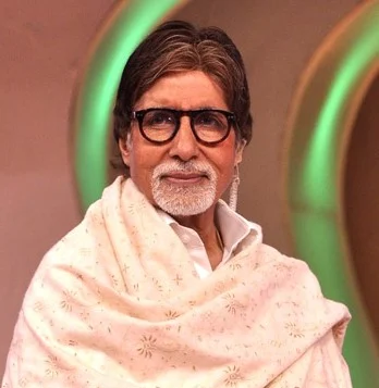 Amitabh Bachchan wearing glasses and a pale shawl while hosting a Cleanathon event