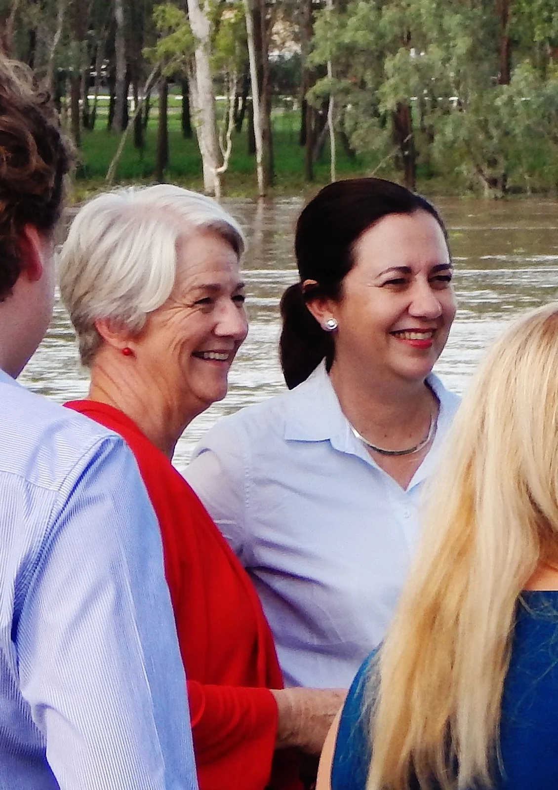 Annastacia Palaszczuk, dark-haired woman right of centre, beside Margaret Strelow near the Fitzroy River in Rockhampton in April 2017.