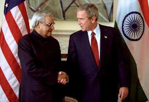 George W. Bush and Atal Bihari Vajpayee shake hands during meetings in New York in September 2003.