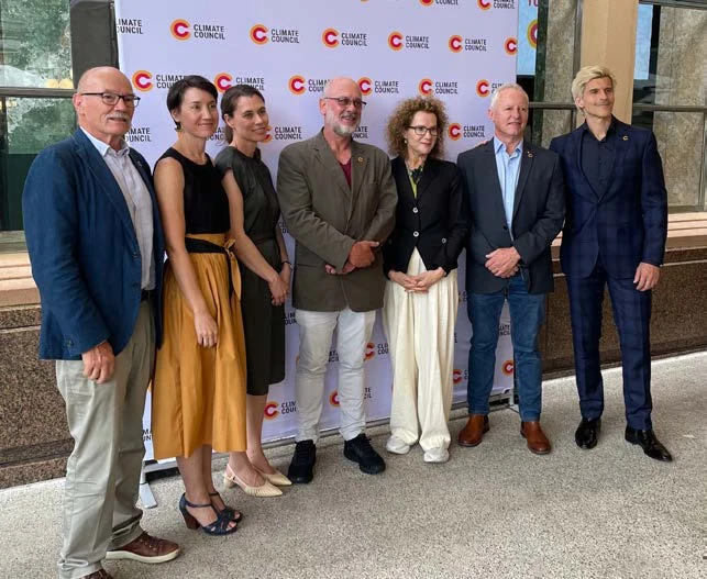 Complete Climate Council group photograph of seven people; Carol Schwartz, wearing glasses, a dark jacket and light trousers, is fifth from the left.