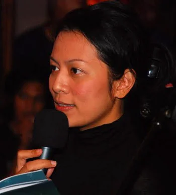 Dee Lestari speaking into a microphone at the Ubud Writers and Readers Festival in October 2010.