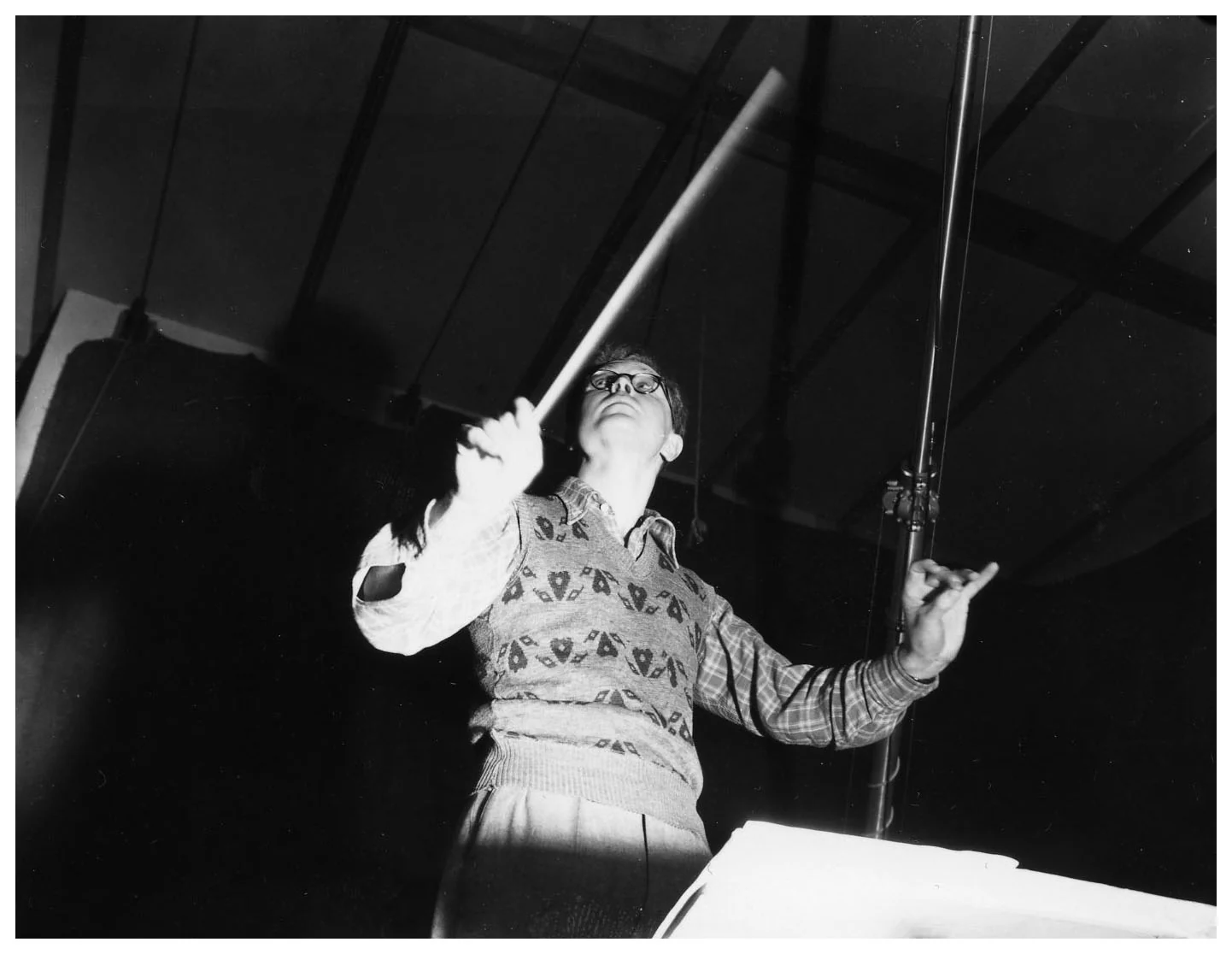 Douglas Lilburn conducting the National Symphony Orchestra for a National Film Unit recording,1948;complete supplied Archives New Zealand photograph.