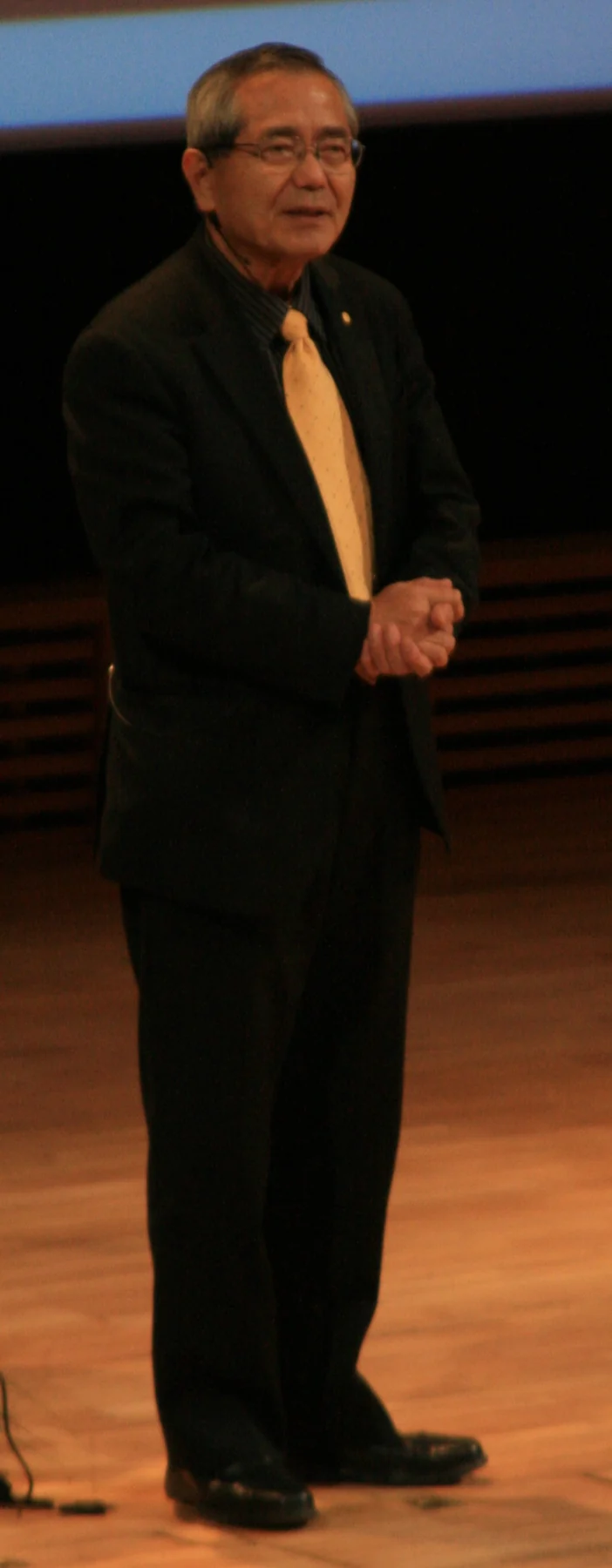 Ei-ichi Negishi in the complete supplied conference photograph.