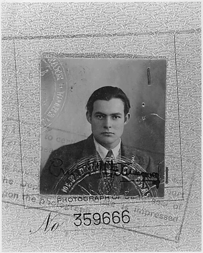 Young Ernest Hemingway in the complete supplied 1923 passport-page photograph, including its patterned paper, stamps and passport number
