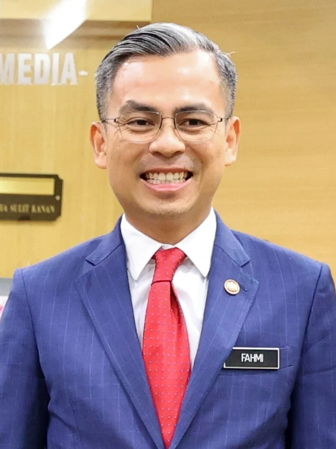 Fahmi Fadzil in a blue suit and red tie, from a January 2023 U.S. Embassy meeting photograph.