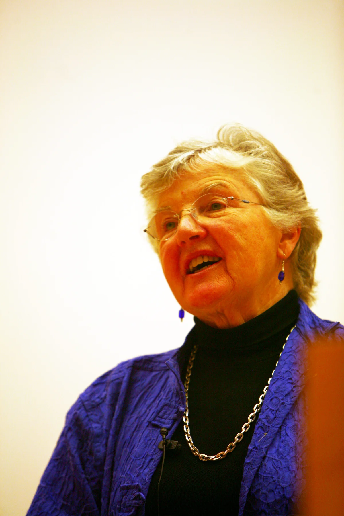 Frances Allen speaking at EPFL in May 2008, wearing glasses and a blue jacket.