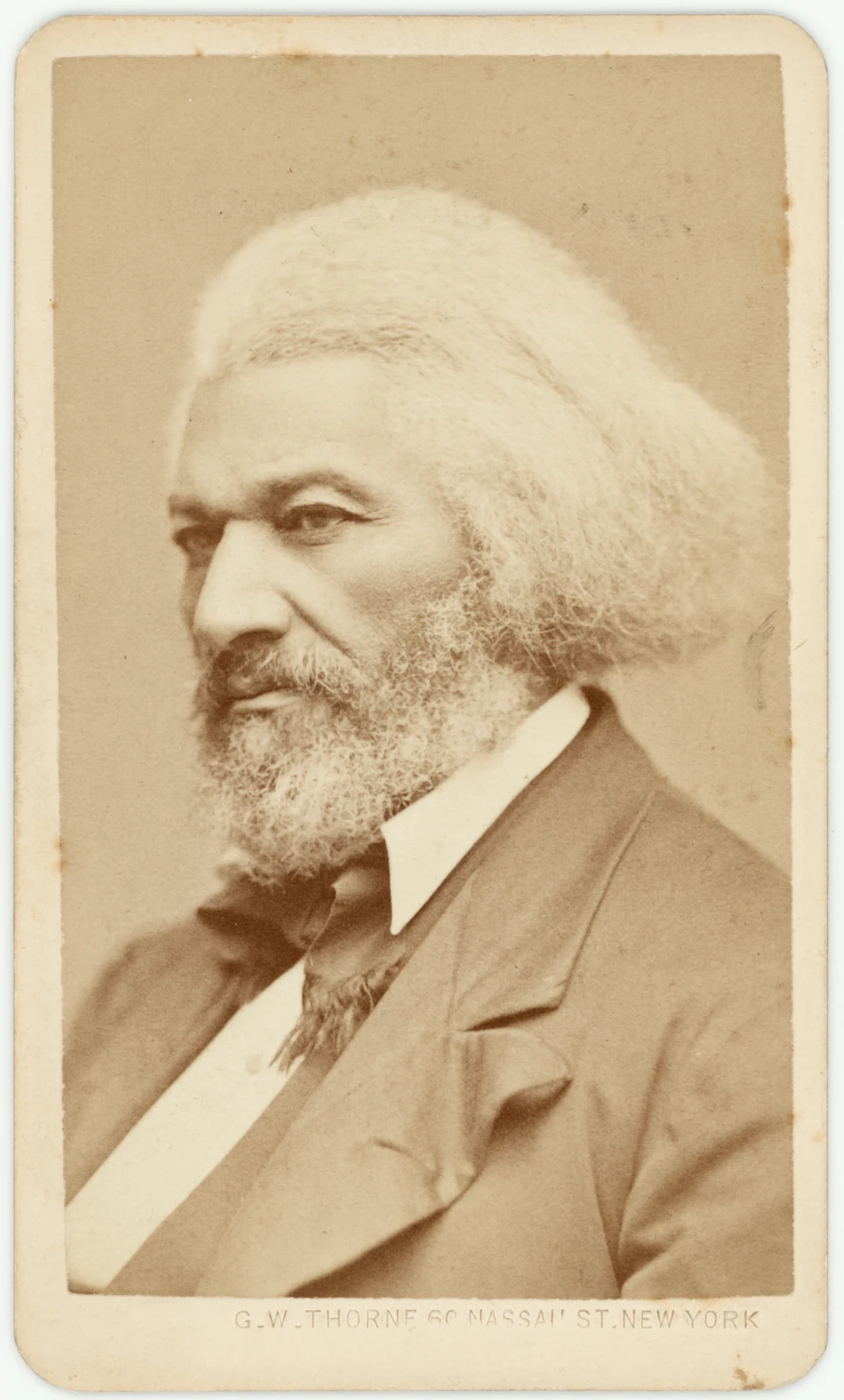 Frederick Douglass in an 1876 albumen silver portrait attributed to George Kendall Warren, with the complete rounded card mount and G.W. Thorne imprint preserved.