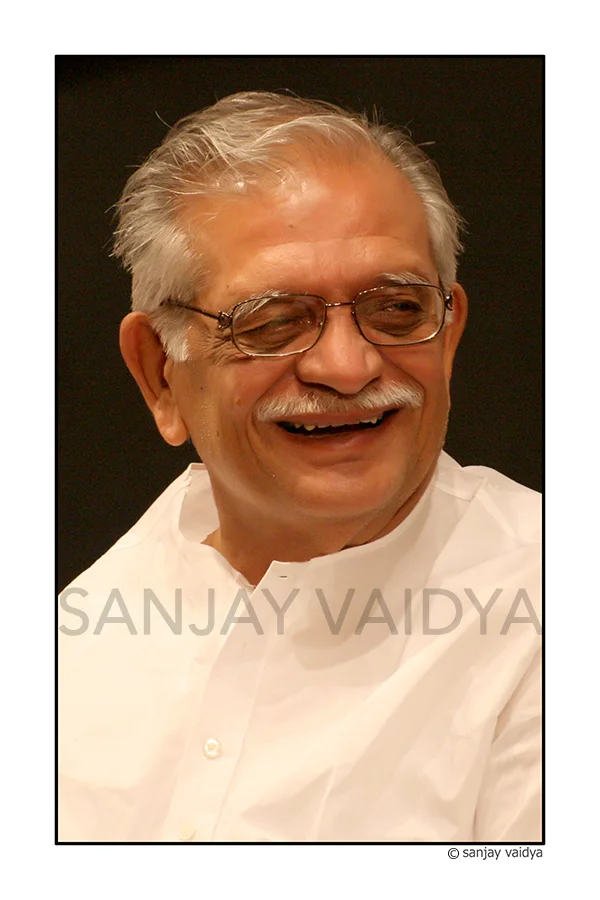Gulzar smiling in Sanjay Vaidya’s complete bordered and watermarked portrait