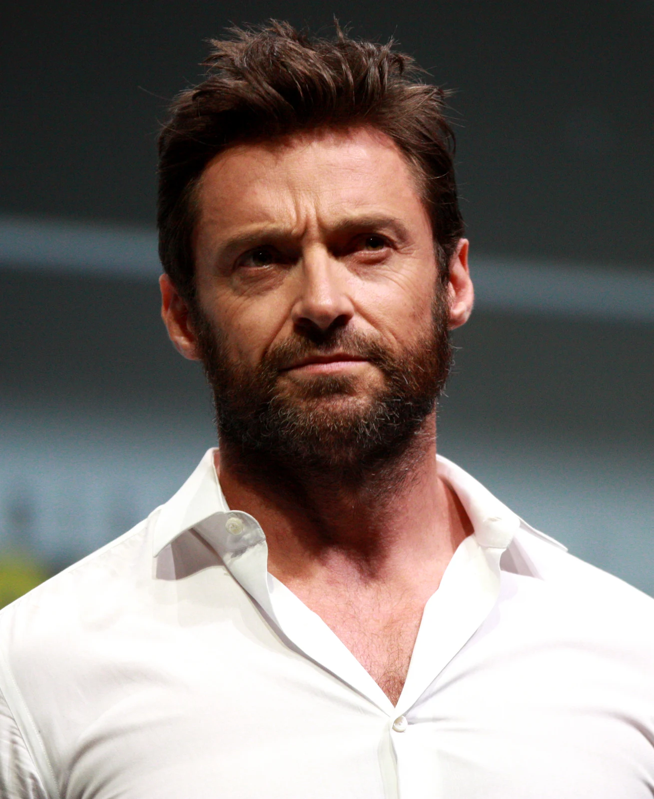 Hugh Jackman with a beard and white shirt at the 2013 San Diego Comic-Con, in the complete photographer-supplied portrait