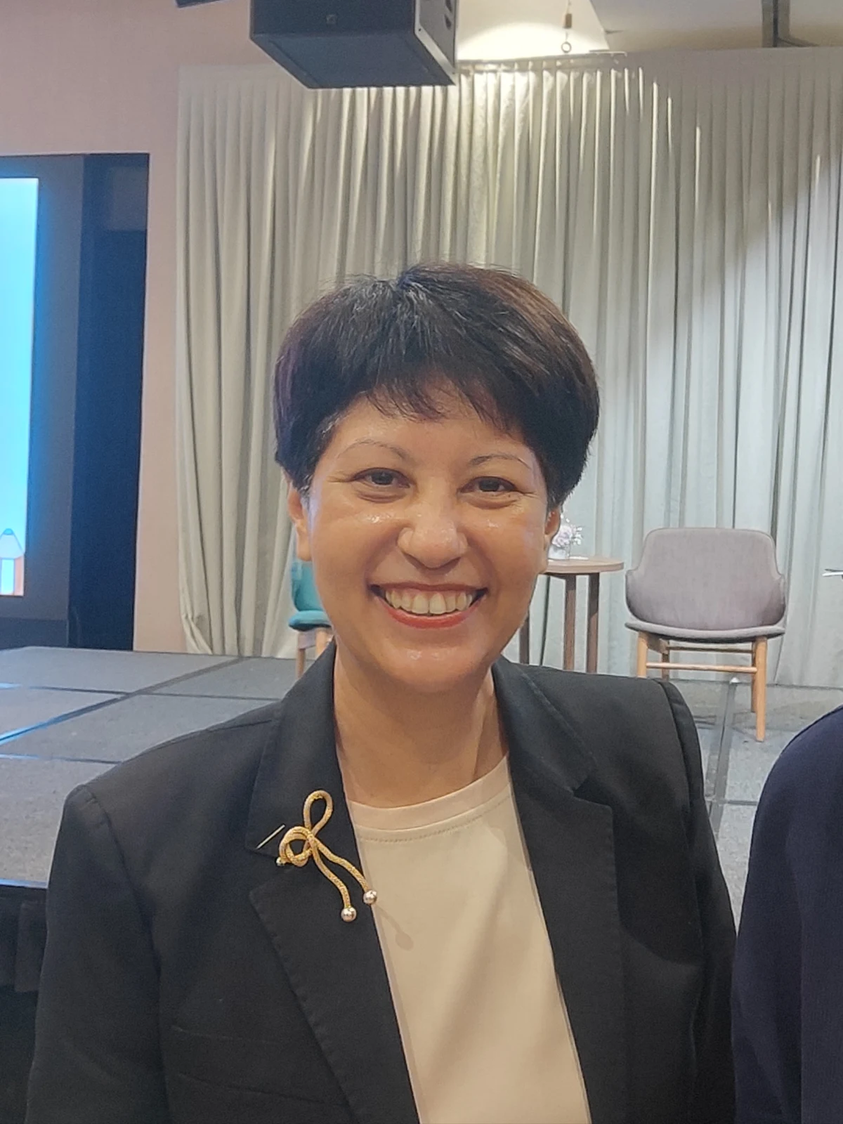 Indranee Rajah wearing a dark jacket at the Built Environment Leaders Retreat in June 2025.