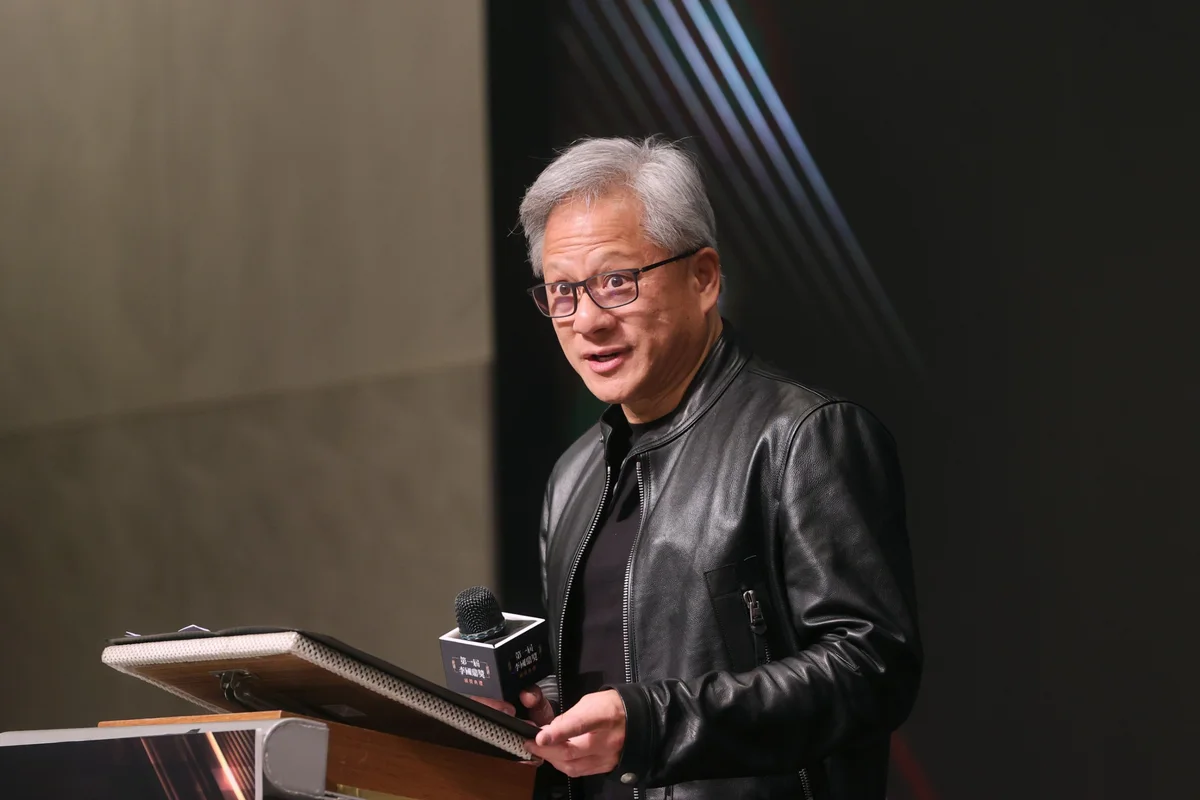 Jensen Huang holding a microphone at the first K. T. Li Award ceremony in Taiwan on 9 November 2023