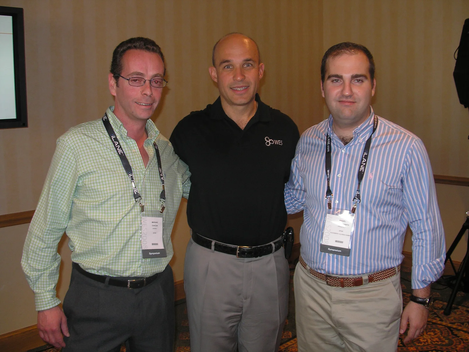 Jim Balsillie in the centre wearing a black WES shirt, standing between two AtelMedia participants in the complete May 2008 group photograph.