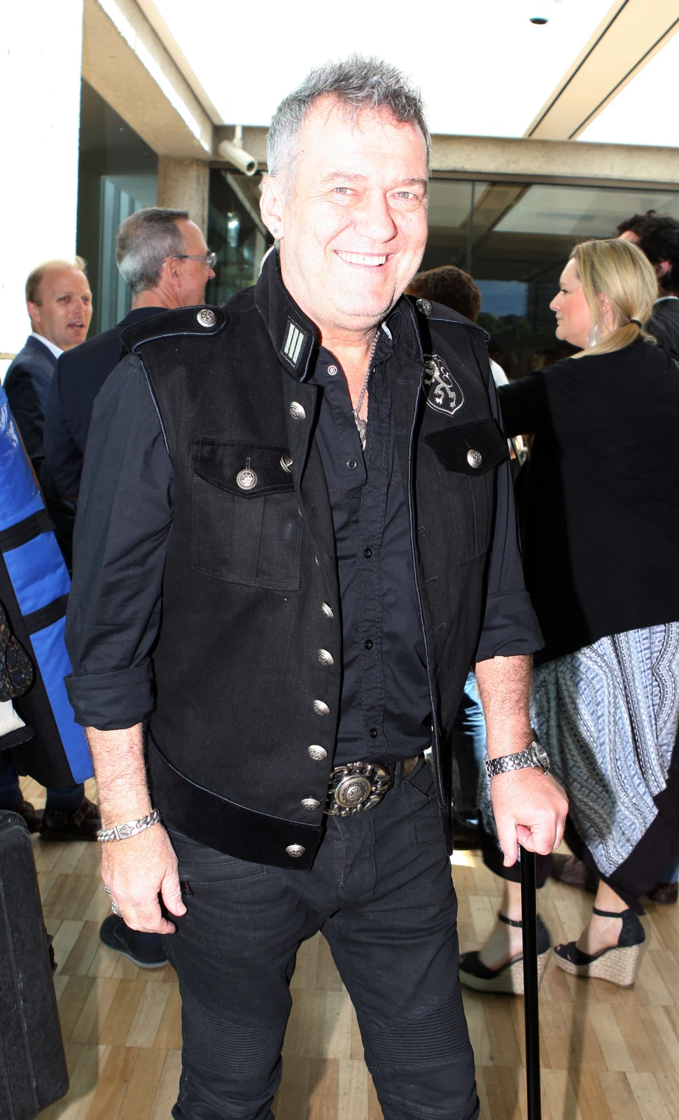 Jimmy Barnes in a black shirt at the 2014 ARIA nominations event, with the complete surrounding guests and venue background retained.