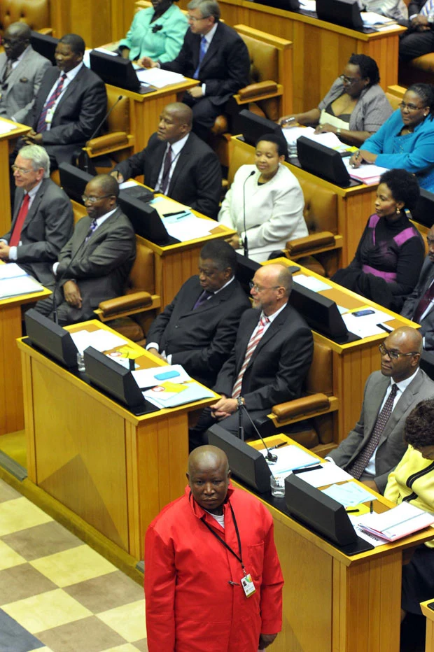 Julius Malema in a red shirt in Parliament during the May 2014 swearing-in ceremony.