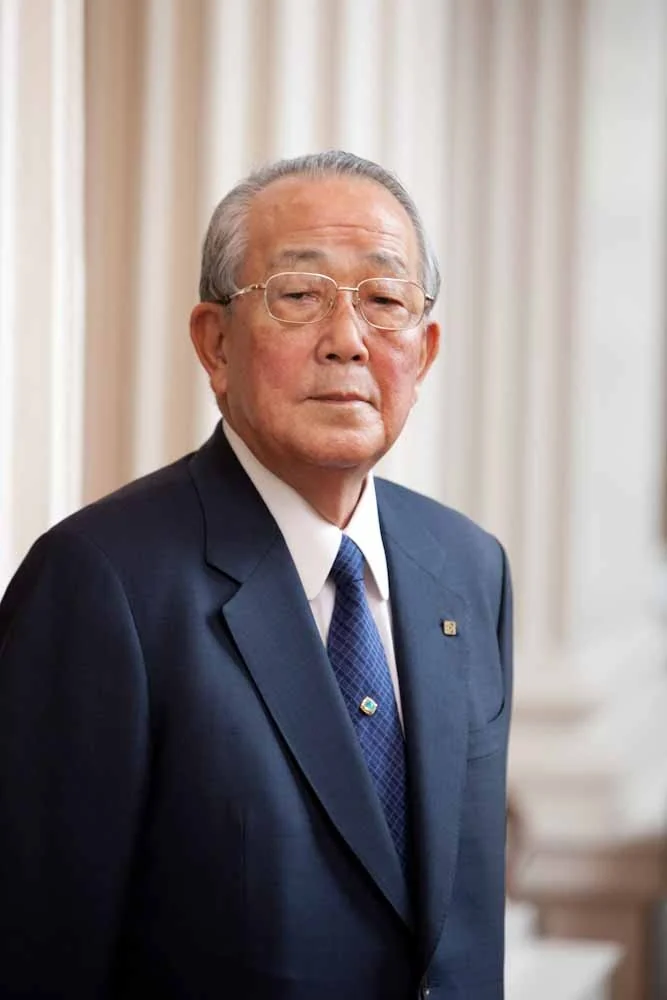 Kazuo Inamori wearing a dark suit and glasses at Heritage Day in Philadelphia, 2011.