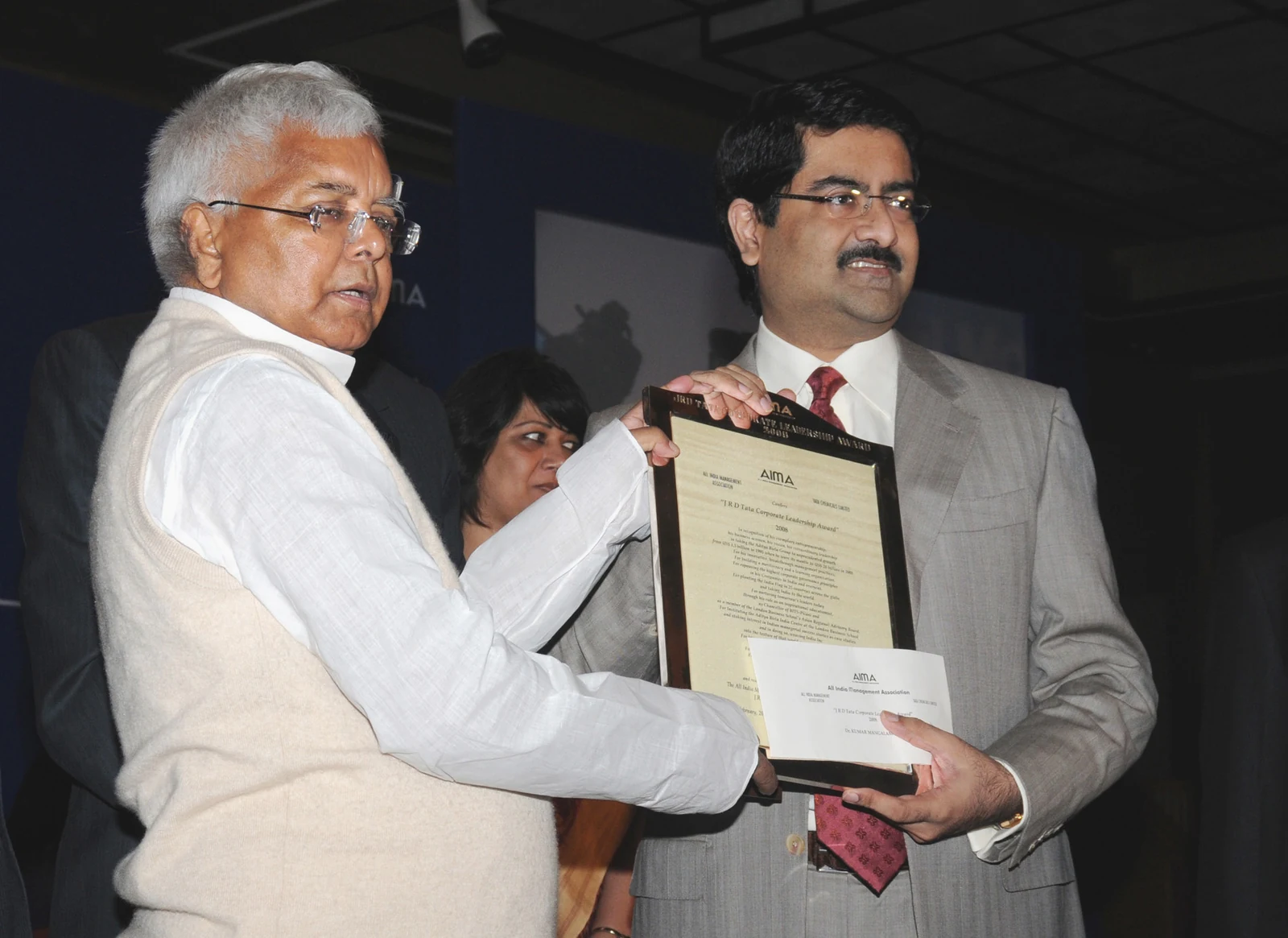 Kumar Mangalam Birla at right receiving an award from Lalu Prasad in New Delhi in February 2009; the complete ceremony frame is retained.