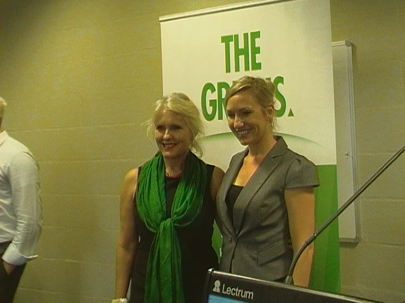 Larissa Waters, right, beside Rainee Skinner at a 2012 Greens event, with the lectern, backdrop and person at the left edge retained.