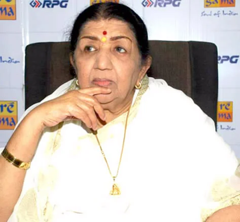 Lata Mangeshkar wearing a light sari at a Saregama album launch in 2010