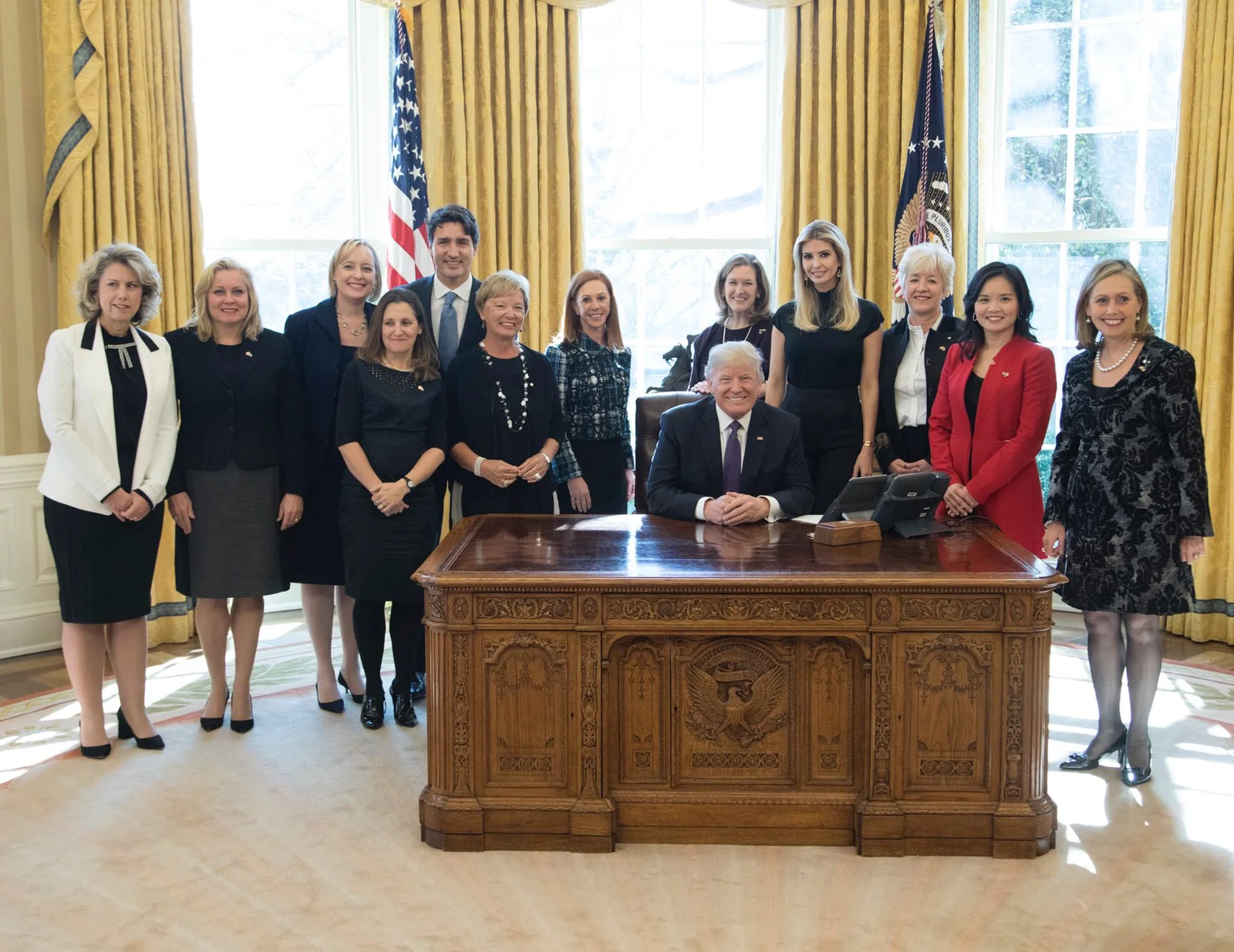 Linda Hasenfratz, second standing person from the left in a black blazer, appears in the complete 2017 White House group photograph with Canadian and American businesswomen and political leaders.