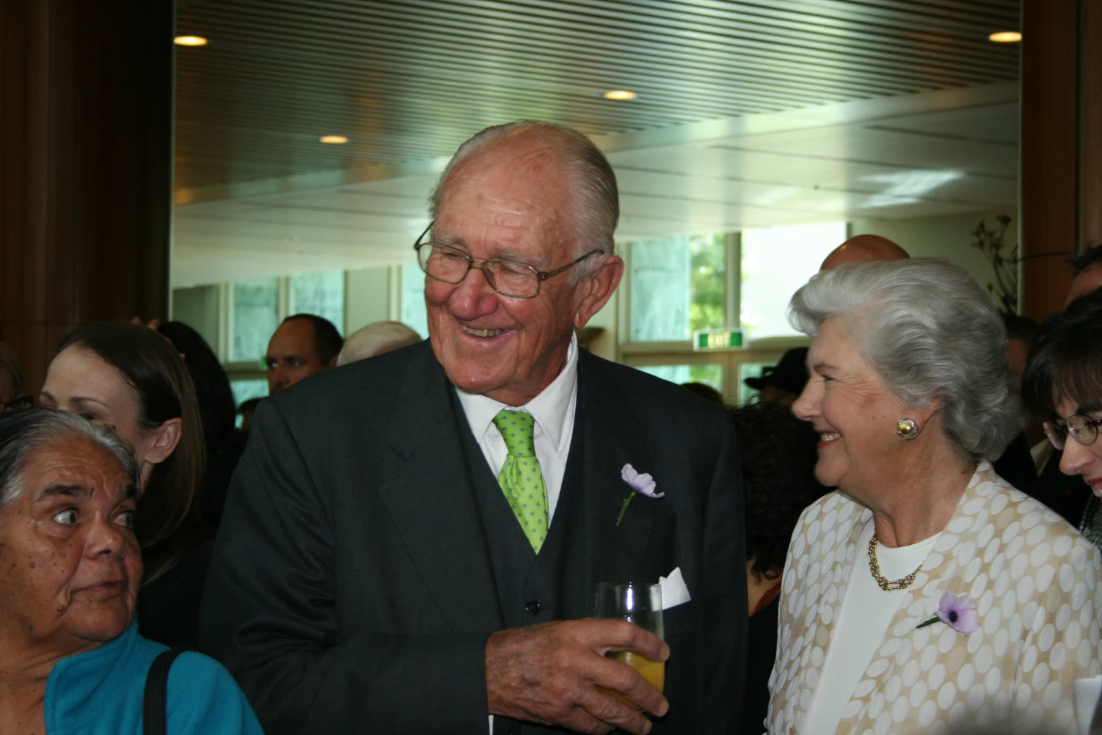 Malcolm Fraser in the centre beside Tamie Fraser and other people after the 2008 Parliamentary Apology, with the entire supplied gallery frame retained.