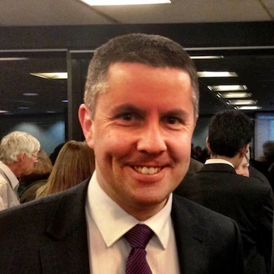 Mark Butler at an ALP function in July 2013, with the complete supplied frame and surrounding attendees retained.