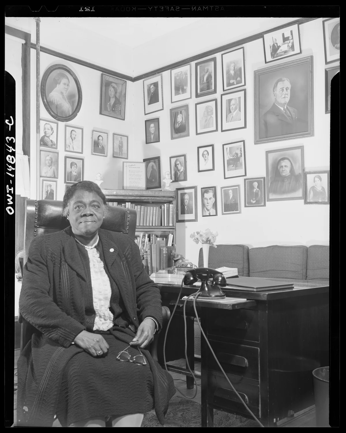 Mary McLeod Bethune seated at her desk at Bethune-Cookman College in Daytona Beach in Gordon Parks’s January 1943 photograph, with the complete negative edges and markings retained.