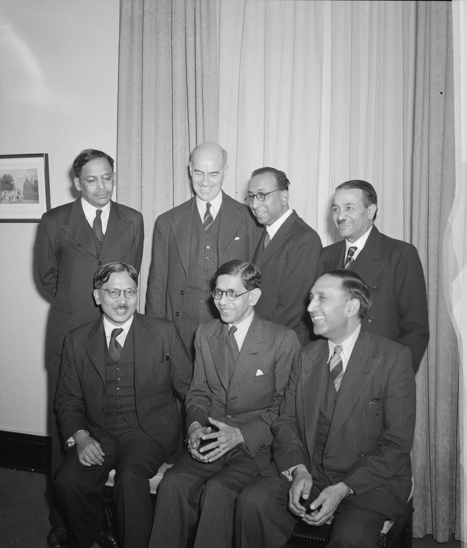 Meghnad Saha standing at far left in the back row of a seven-person Indian scientific delegation photograph, Washington,December 1944. The complete group is retained.