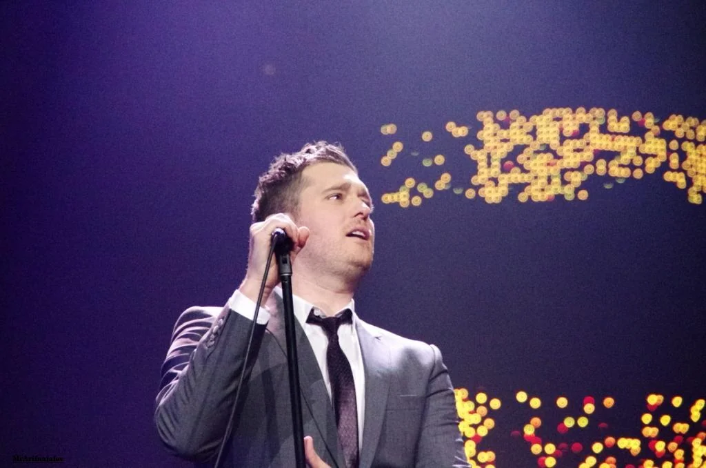 Michael Bublé holding a microphone on stage at Cologne’s Lanxess Arena in April 2012