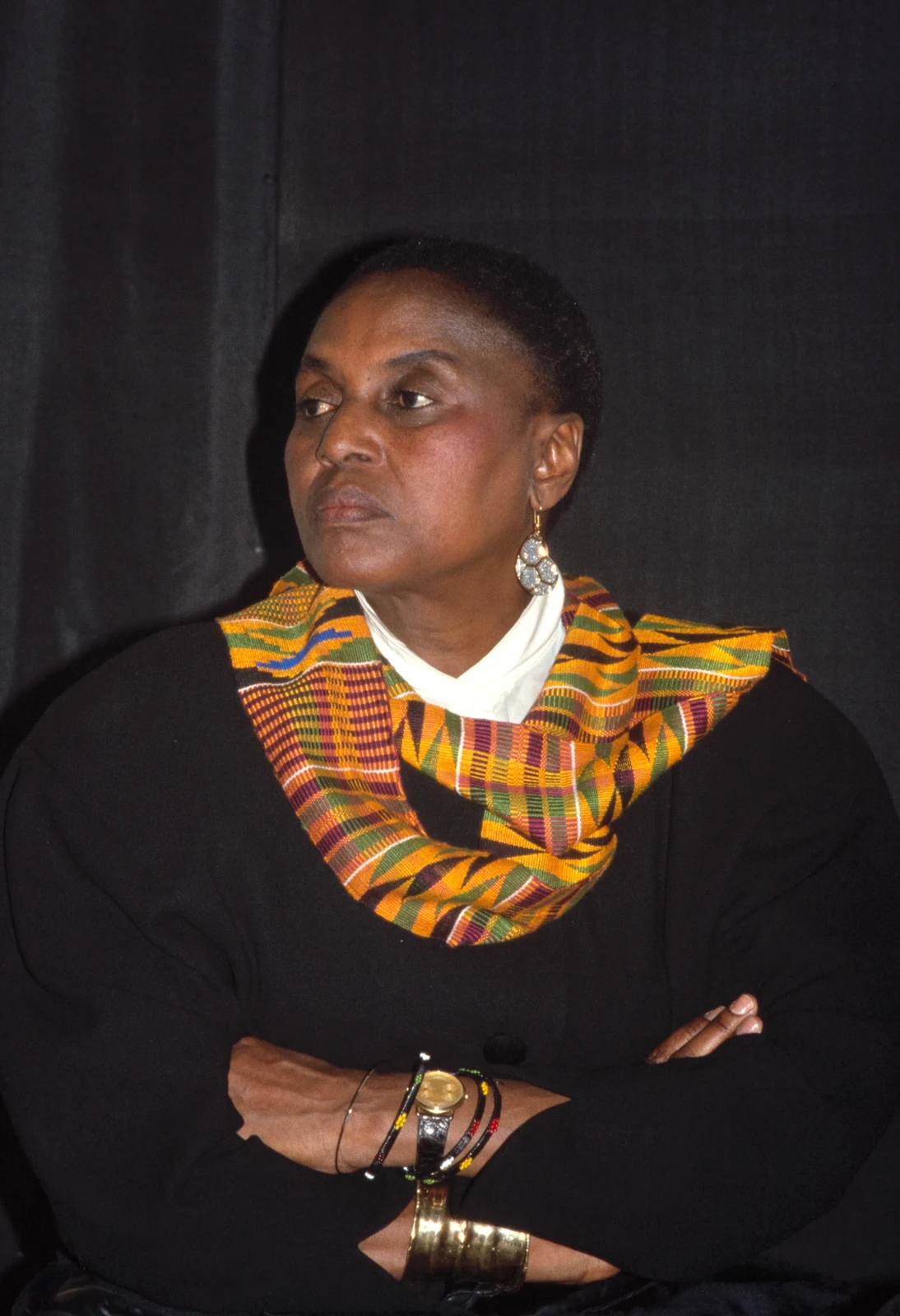 Miriam Makeba in a black jacket and patterned cloth, photographed by Bernard Gotfryd around 1986, with the complete portrait frame retained.