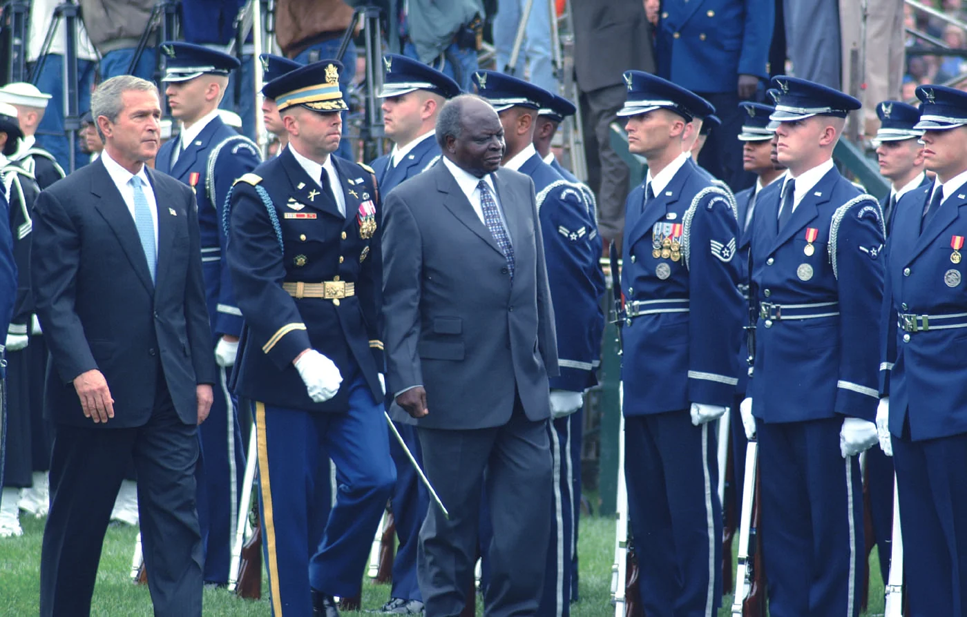 Mwai Kibaki and George W. Bush walking past an Air Force honor guard at the White House, October 2003.