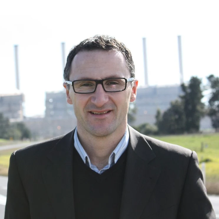 Richard Di Natale in front of Hazelwood power station in 2010, retaining the complete square frame supplied by Colin Jacobs.