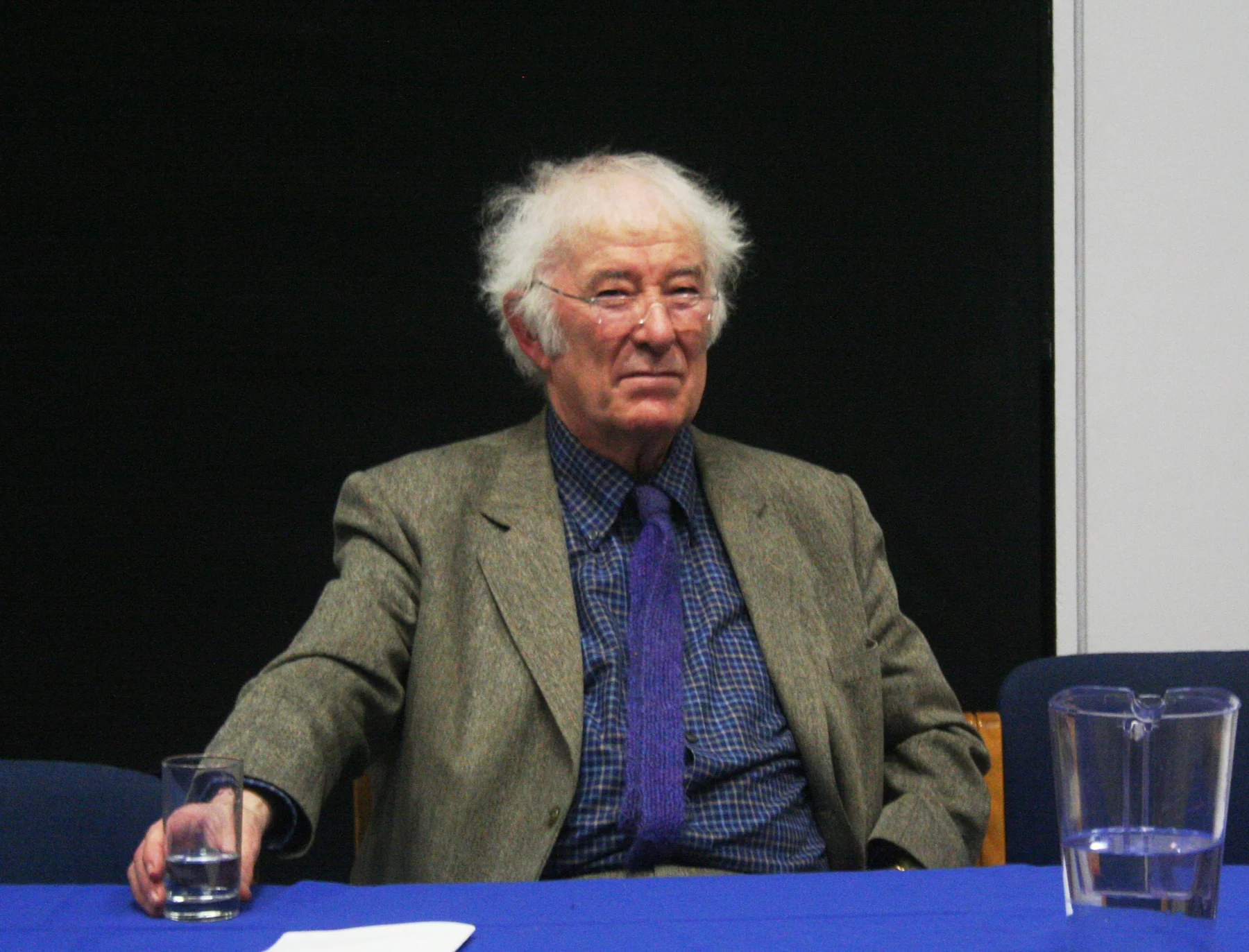 Seamus Heaney seated at University College Dublin on 11 February 2009