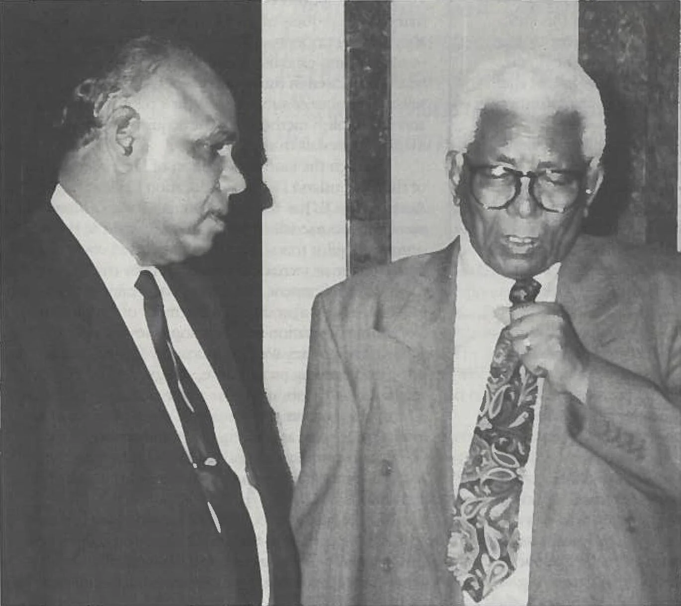 Walter Sisulu at right with Commonwealth of Learning president James Maraj at left.