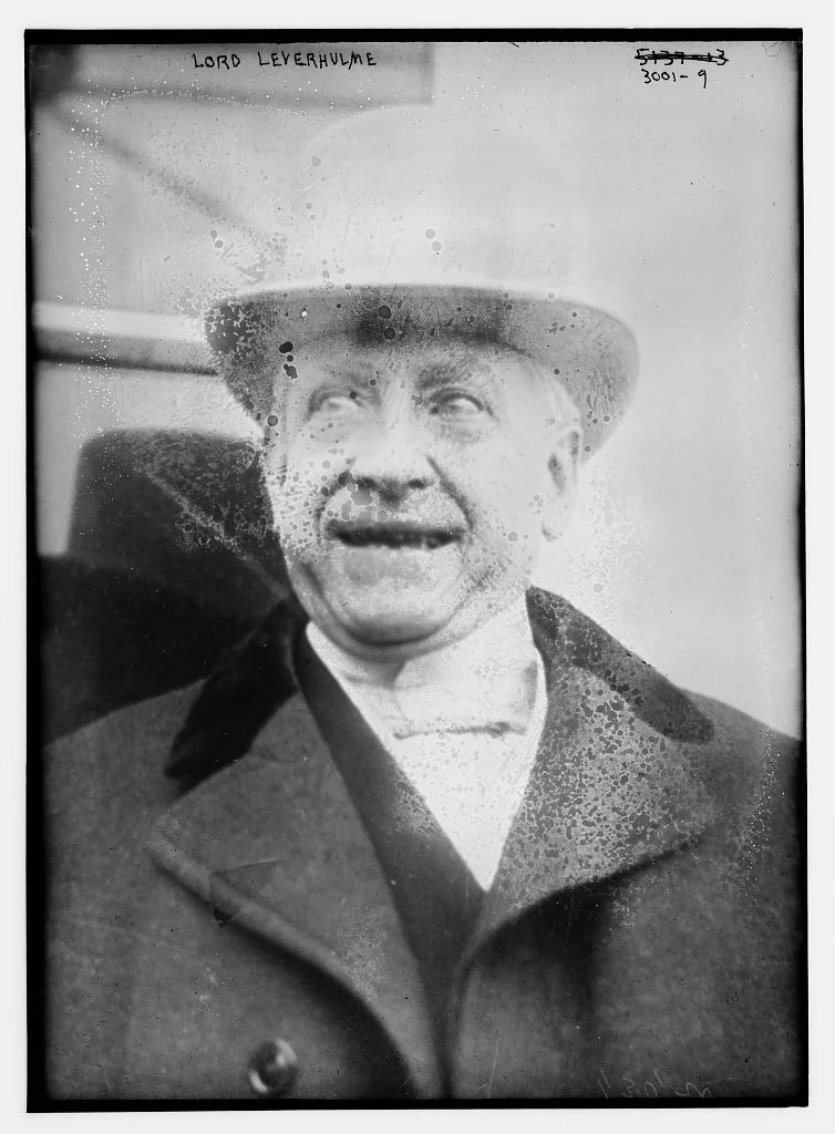 William Hesketh Lever in a bowler hat and coat; complete Bain glass-negative frame with handwritten identification, border and visible surface damage.