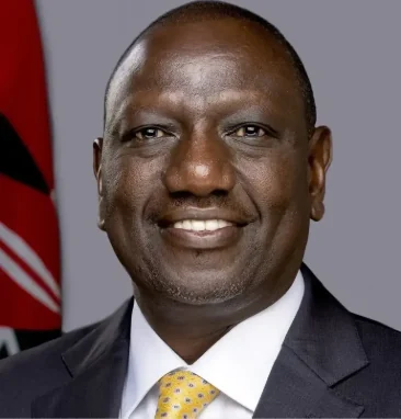 Official portrait of William Ruto wearing a dark suit and patterned yellow tie.