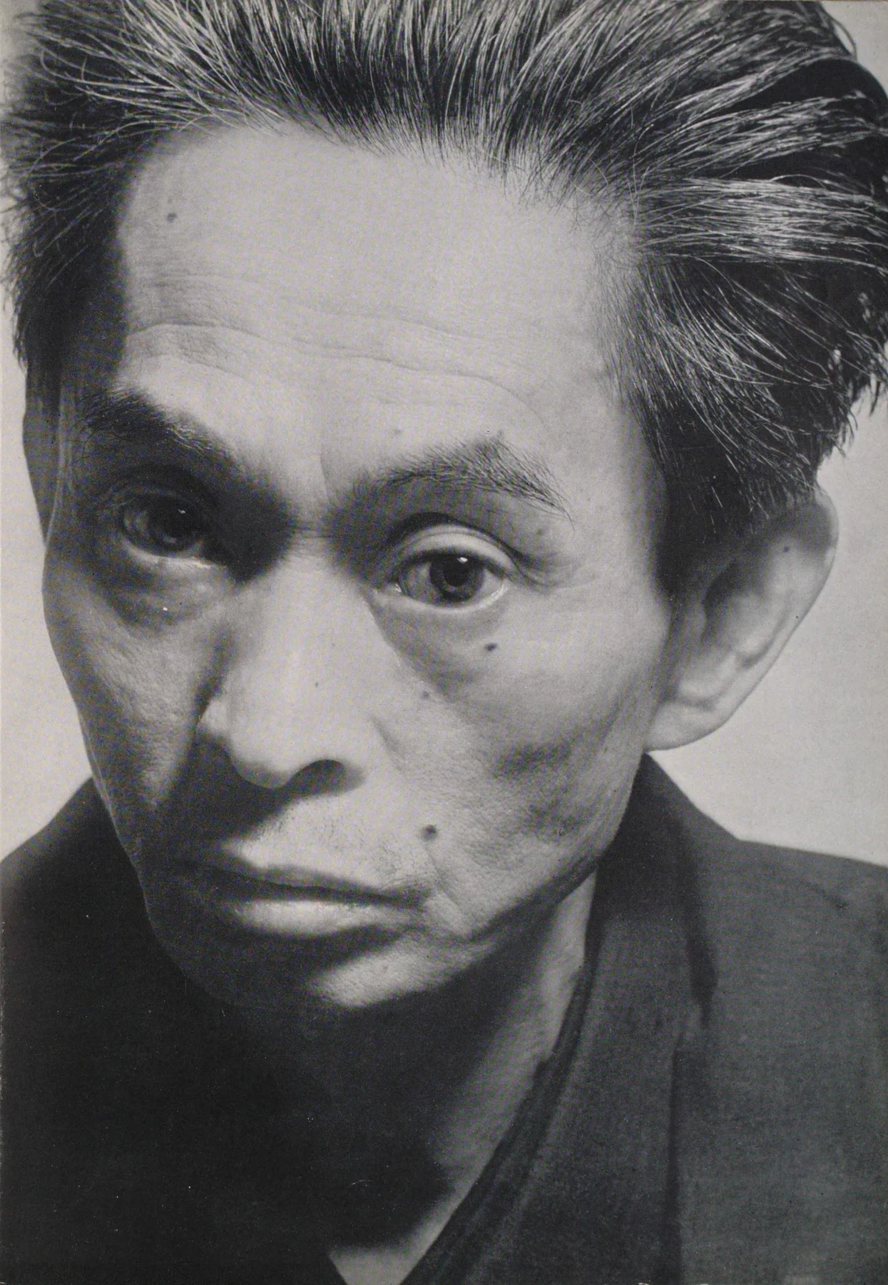 Yasunari Kawabata in Ken Domon’s close portrait, published in 1953.